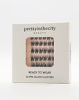cluster eyelash packaging with 'prettyinthecity beauty' branding on a white background