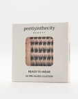 cluster eyelash packaging with 'prettyinthecity beauty' branding on a white background
