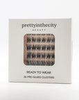 Lash Cluster packaging with 'prettyinthecity Beauty' branding on a white background