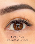 Close-up of an eye with natural cluster lashes labeled 'Twinkle' on a beige background