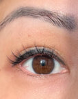 womans eye with natural short spiky lashes on