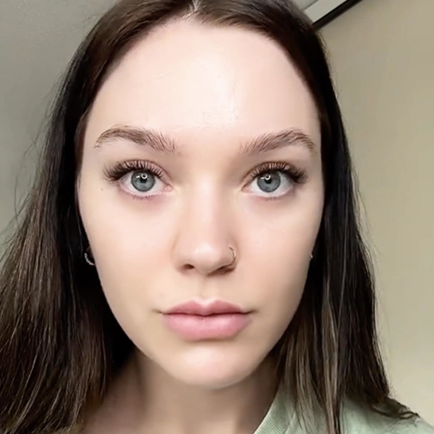 woman wearing cluster lashes