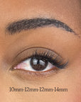 close up of womans eye showing false lash clusters on 2/3 of outer eye.