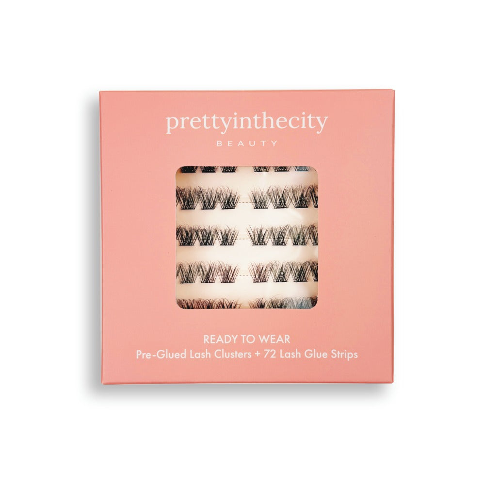 pre glued eyelash cluster box with 'prettyinthecity beauty' branding on a pink background