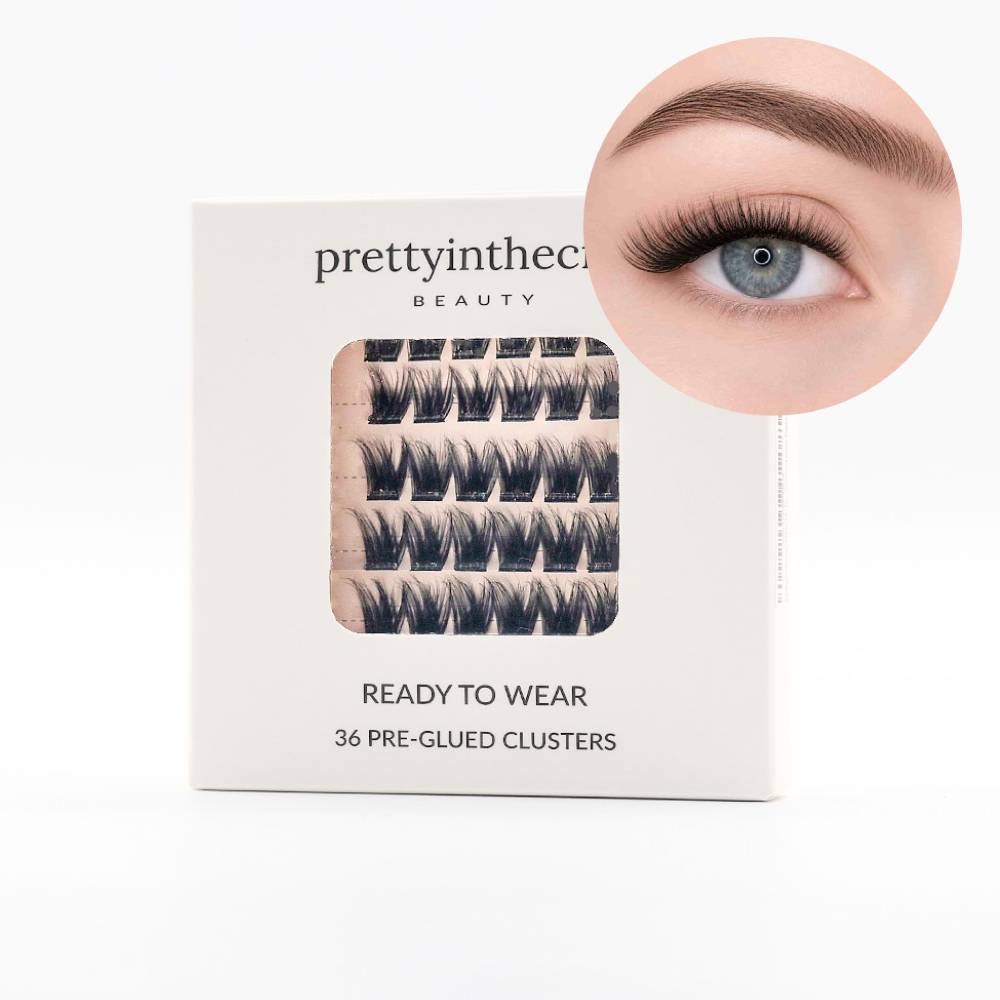 Press on eyelash packaging with a close-up of an eye wearing the lashes on a white background