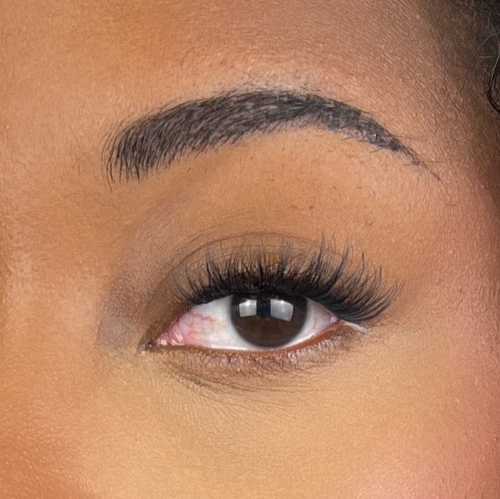 close up of dramatic lash clusters on a black woman