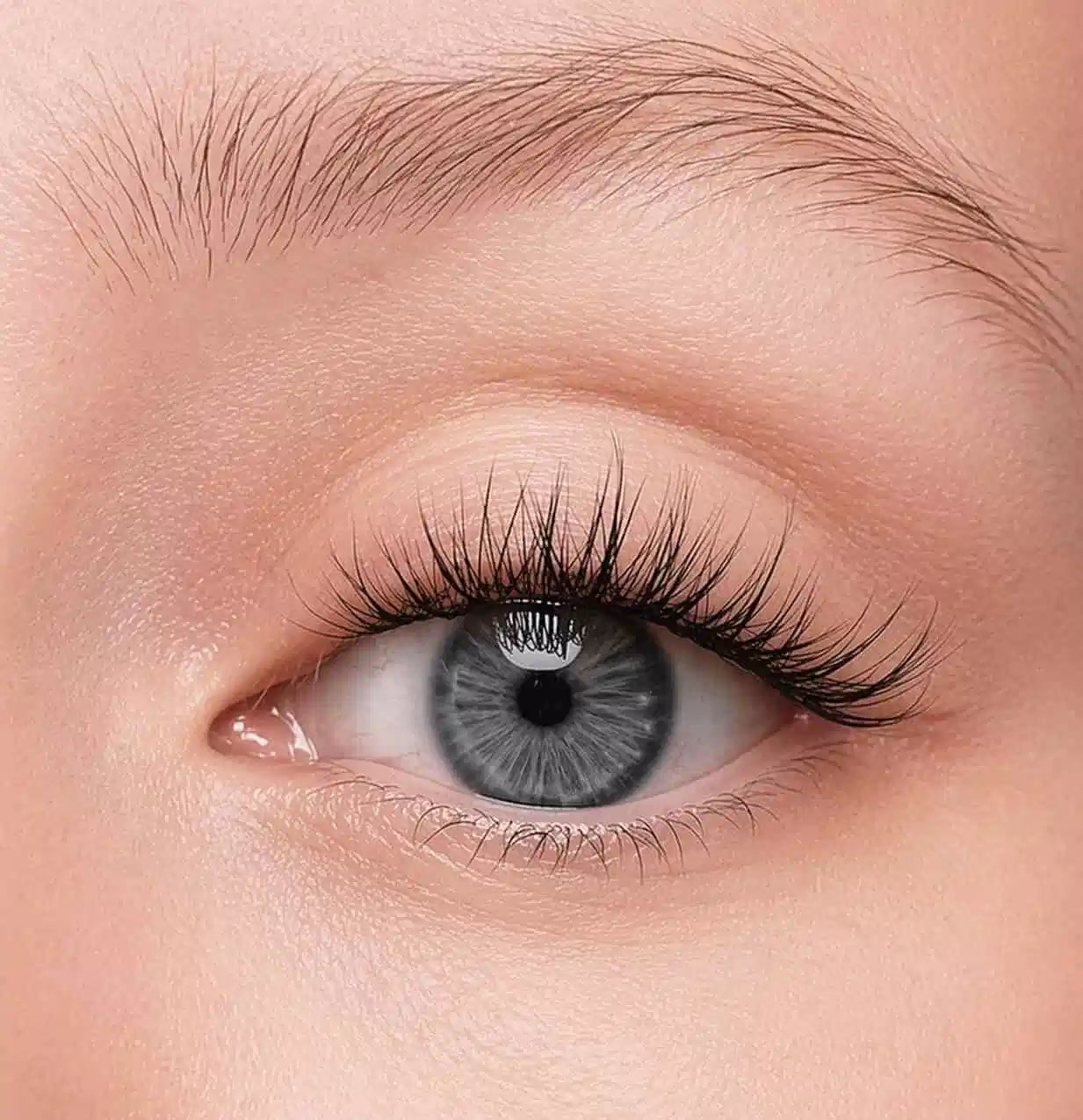 Close-up of a person's eye with press on lash clusters.