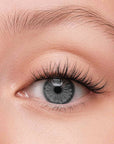 Close-up of a person's eye with press on lash clusters in the natural pretty style