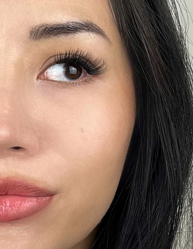 woman wearing dramatic and full volume cluster lashes