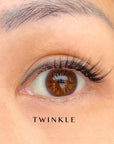 Close-up of an eye with false eyelashes labeled 'twinkle'.