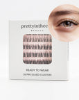 Eyelash packaging with a close-up of an eye wearing the press on false eyelashes, branded 'prettyinthecity Beauty'.